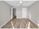 Spacious bedroom featuring wood-look flooring and neutral walls at 100 Bluff View Dr # 205C, Belleair Bluffs, FL 33770