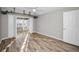 A spacious bedroom with great lighting, light wood floors, and a large ceiling fan at 100 Bluff View Dr # 205C, Belleair Bluffs, FL 33770