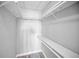 Functional closet space with shelving, hanging racks and light wood flooring at 100 Bluff View Dr # 205C, Belleair Bluffs, FL 33770
