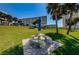 Condo exterior with picnic and playground area surrounded by beautiful grounds at 100 Bluff View Dr # 205C, Belleair Bluffs, FL 33770