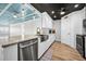 Remodeled kitchen with stainless appliances, modern countertops, and sleek white cabinetry at 100 Bluff View Dr # 205C, Belleair Bluffs, FL 33770