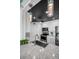 Tastefully designed kitchen with stainless steel appliances, white cabinetry and stylish pendant lights at 100 Bluff View Dr # 205C, Belleair Bluffs, FL 33770