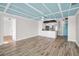Spacious living room boasts stylish flooring, seamlessly connecting to a modern kitchen, perfect for contemporary living at 100 Bluff View Dr # 205C, Belleair Bluffs, FL 33770