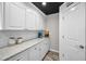 Spacious pantry with white cabinets, elegant countertops, and a conveniently located pantry door for organized storage at 100 Bluff View Dr # 205C, Belleair Bluffs, FL 33770