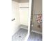 Updated shower features white tile, a built-in seat, and eye-catching mosaic tile flooring at 100 Bluff View Dr # 205C, Belleair Bluffs, FL 33770