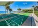 Outdoor shuffleboard courts with covered seating offer a fun community activity with beautiful waterfront views at 100 Bluff View Dr # 205C, Belleair Bluffs, FL 33770