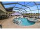 Screened in pool features connected spa, water features, and views of the pond at 11910 Climbing Fern Ave, Riverview, FL 33579