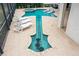 Aerial view of the custom-designed guitar-shaped pool with a spa, sun loungers and tiled patio at 11910 Climbing Fern Ave, Riverview, FL 33579