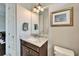 Bathroom featuring granite countertop vanity, and decorative framed wall art at 1308 Alhambra Dr, Apollo Beach, FL 33572