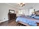 Spacious bedroom features a ceiling fan, dark wood floors, and comfortable furnishings at 1308 Alhambra Dr, Apollo Beach, FL 33572