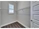 This closet features hardwood floors, a window and wire rack shelving at 1308 Alhambra Dr, Apollo Beach, FL 33572
