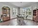 Bright dining area with large windows offering natural light, hardwood floors, and traditional decor at 1308 Alhambra Dr, Apollo Beach, FL 33572