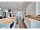 Spacious kitchen featuring an expansive island, stainless steel appliances, and custom backsplash for a modern look at 1308 Alhambra Dr, Apollo Beach, FL 33572