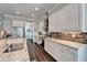 Modern kitchen equipped with stainless steel appliances, granite countertops, and ample cabinet space for storage at 1308 Alhambra Dr, Apollo Beach, FL 33572