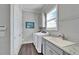 Clean laundry room featuring a sink, modern washer and dryer, and plenty of storage space at 1308 Alhambra Dr, Apollo Beach, FL 33572