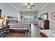 Serene main bedroom with sliding door access to balcony, hardwood floors and generous natural light at 1308 Alhambra Dr, Apollo Beach, FL 33572
