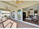 Covered patio featuring comfortable lounge seating, ceiling fans, and access to both indoor and outdoor living spaces at 1308 Alhambra Dr, Apollo Beach, FL 33572