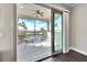 Screened in patio with ceiling fan and views of palm trees at 1308 Alhambra Dr, Apollo Beach, FL 33572