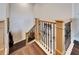 Wood staircase with wood and rod iron railing leading to the next level at 1308 Alhambra Dr, Apollo Beach, FL 33572