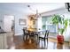 Charming dining room with hardwood floors, chandelier, and views to outside at 1926 Burlington N Ave, St Petersburg, FL 33713