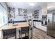 Bright kitchen featuring updated appliances, custom cabinetry, and a stylish butcher block island at 1926 Burlington N Ave, St Petersburg, FL 33713