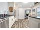 Modern kitchen featuring stainless steel appliances, stylish cabinets and granite countertops at 1926 Burlington N Ave, St Petersburg, FL 33713