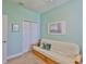 Calm bedroom featuring a futon, closet, and soft, neutral carpet at 6516 Salt Creek Ave, Apollo Beach, FL 33572
