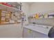 Organized laundry room with washer, dryer, shelving, and storage at 6516 Salt Creek Ave, Apollo Beach, FL 33572