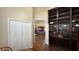 Inviting living room featuring a charming built-in bookcase and an open doorway to other rooms at 1743 Arabian Ln, Palm Harbor, FL 34685