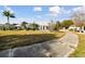 Beautiful backyard with a well-manicured lawn and landscaping at 326 Caloosa Woods Ln, Sun City Center, FL 33573