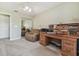 Bedroom featuring a desk, recliner, and closet with mirrored doors and a light ceiling fan fixture at 326 Caloosa Woods Ln, Sun City Center, FL 33573