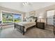 Cozy bedroom features a large window with a window seat and natural light at 326 Caloosa Woods Ln, Sun City Center, FL 33573