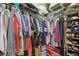 Well-organized walk-in closet with hanging space, shelving, and shoe storage at 326 Caloosa Woods Ln, Sun City Center, FL 33573