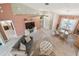 Bright living room with comfortable seating, high ceilings, and stylish decor at 326 Caloosa Woods Ln, Sun City Center, FL 33573