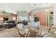 Open living room with large windows, chandeliers and unique decor at 326 Caloosa Woods Ln, Sun City Center, FL 33573
