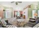Cozy living room with plush seating, natural light, and a welcoming atmosphere at 326 Caloosa Woods Ln, Sun City Center, FL 33573