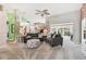 Bright living room features high ceilings, carpeted floors and expansive windows at 326 Caloosa Woods Ln, Sun City Center, FL 33573