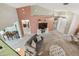 Bright living room with comfortable seating, modern entertainment center, and natural light at 326 Caloosa Woods Ln, Sun City Center, FL 33573
