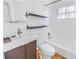 Bathroom featuring dark wood vanity and tile flooring with a shower and tub at 5032 19Th N St, St Petersburg, FL 33714