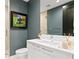 Modern bathroom with vanity, framed art, and a glass-enclosed shower creating a clean and stylish space at 301 1St S St # 1002, St Petersburg, FL 33701