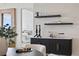 Elegant dining room with stylish server, decorative accents, and a modern ambiance at 301 1St S St # 1002, St Petersburg, FL 33701