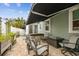 Outdoor patio with paver flooring, hot tub, awning, and outdoor furniture at 487 9Th N Ave, St Petersburg, FL 33701
