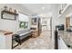 Kitchen features white cabinets and an island at 487 9Th N Ave, St Petersburg, FL 33701