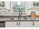 Updated kitchen featuring granite countertops, stainless steel appliances, and white cabinetry at 487 9Th N Ave, St Petersburg, FL 33701