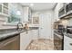 Updated kitchen featuring granite countertops, stainless steel appliances, and white cabinetry at 487 9Th N Ave, St Petersburg, FL 33701
