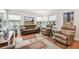 Cozy living room featuring hardwood floors, neutral tones, and ample natural light at 487 9Th N Ave, St Petersburg, FL 33701
