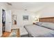 Cozy main bedroom with hardwood floors, a walk-in closet, and a neutral color palette at 487 9Th N Ave, St Petersburg, FL 33701