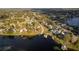 Aerial neighborhood and lake view showcases large lots and wooded areas at 2972 Lake Saxon Dr, Land O Lakes, FL 34639