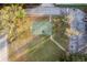 Aerial view featuring a basketball court adjacent to a parking lot, set in a community space at 2972 Lake Saxon Dr, Land O Lakes, FL 34639