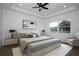 Calm and bright main bedroom with large windows, neutral decor, and stylish tray ceilings at 2972 Lake Saxon Dr, Land O Lakes, FL 34639
